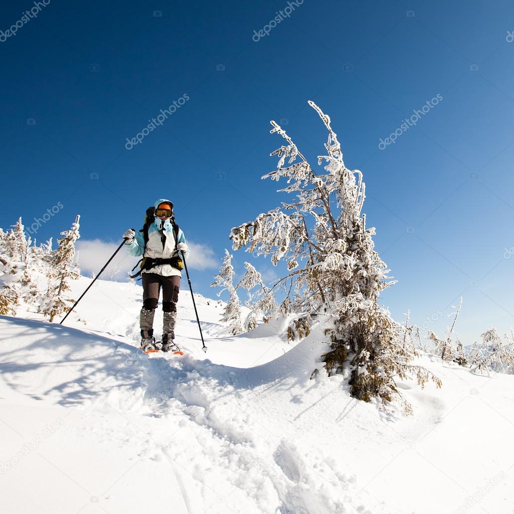 Hiker in winter mountains