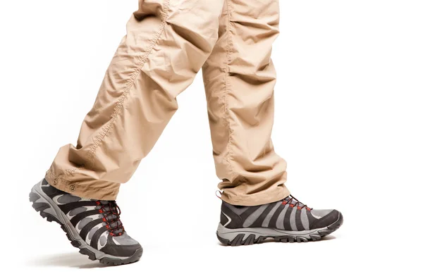Hiker's legs in move at white background — Stock Photo, Image