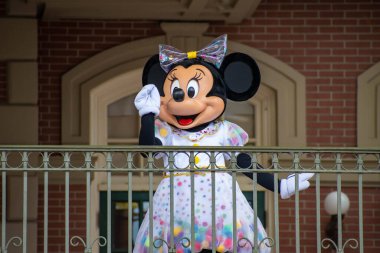 Orlando, Florida. August 04, 2020. Minnie Mouse waving from the balcony at Walt Disney World Railroad at Magic Kingdom (357). clipart