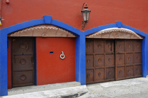 Colorful walls and gates in the historic Coyoacan neighborhood of Mexico City