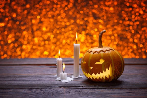 Pumpkins for Halloween and burning candles