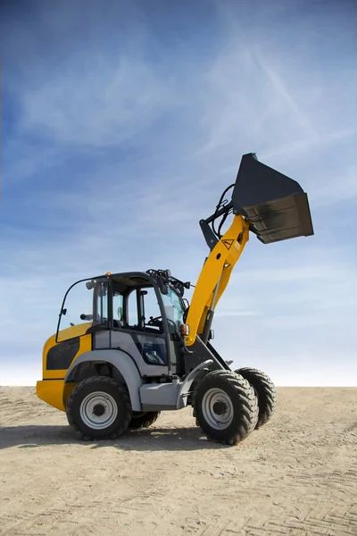 Tractor with raised bucket — Stock Photo, Image