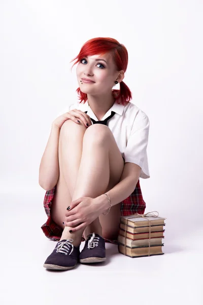 Young girl in anime style with books — Stock Photo, Image