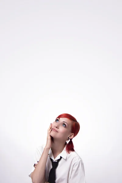 Beautiful girl on a white background looking up — Stock Photo, Image