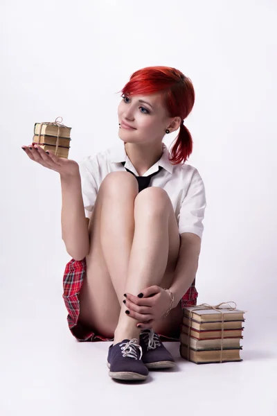 Beautiful girl in anime style with stacks of books — Stock Photo, Image