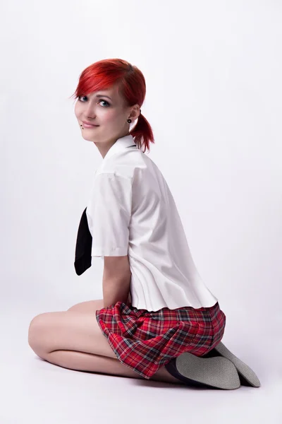 Anime girl in short skirt on a white background — Stock Photo, Image