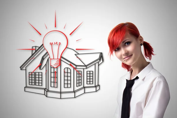 Red-haired girl makes a house project — Stock Photo, Image