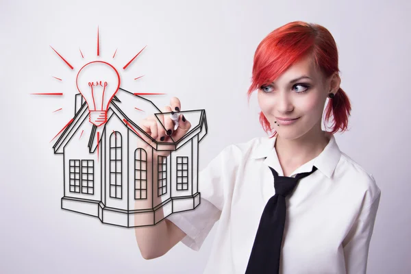 Red-haired girl draws a house drawing — Stock Photo, Image