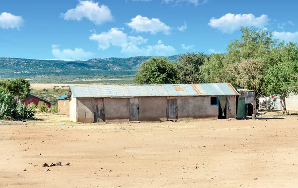 Poor village of Kenya in a sunny day. Its African landscape.