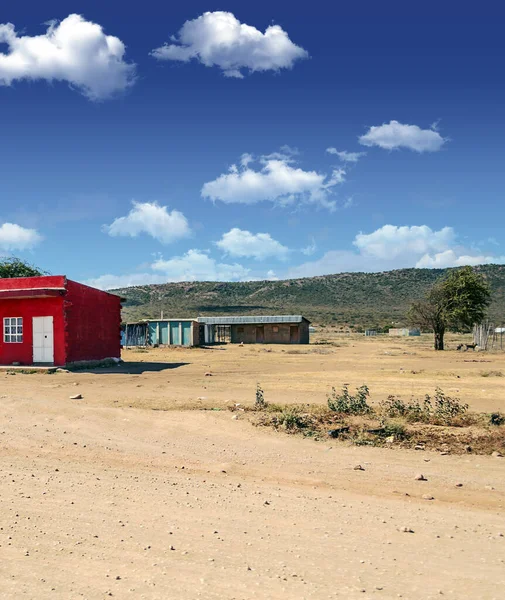 Poor village of Kenya in a sunny day. Its African landscape.