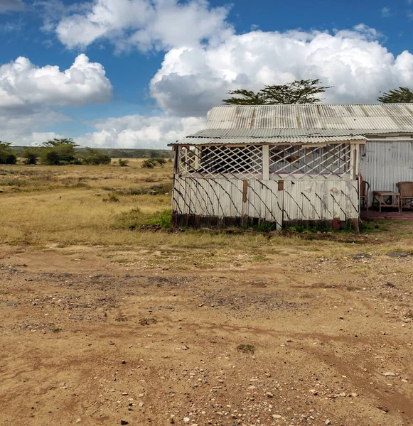 Poor village of Kenya in a sunny day. Its African landscape.