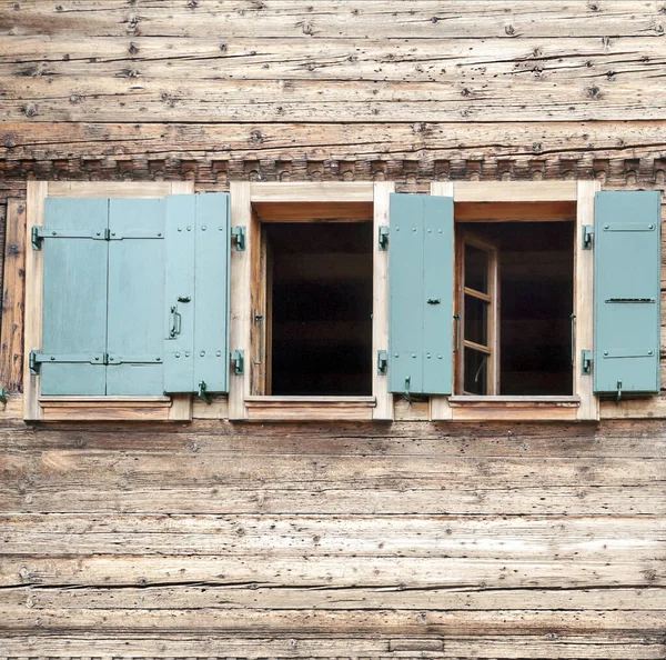 Old window on a stone wall