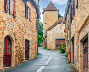Medieval village of Aquitaine with its stone houses in the south of France on a sunny day. clipart