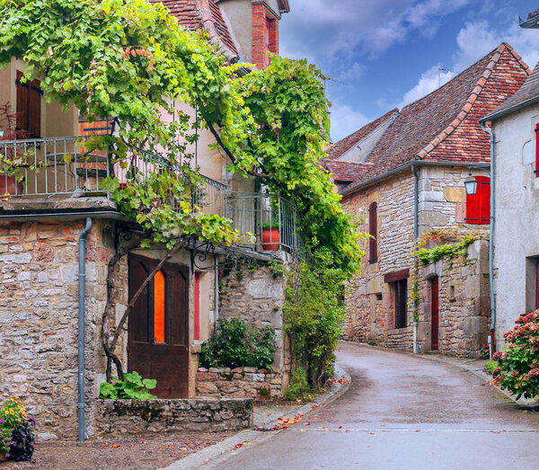 Medieval village of Aquitaine with its stone houses in the south of France on a sunny day.