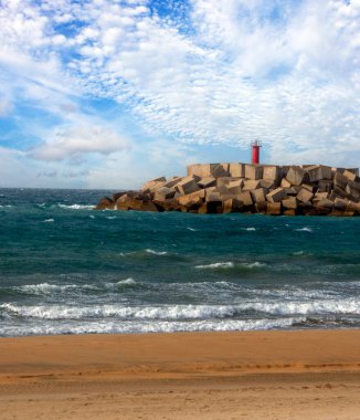 Coast in Conil de la Frontera in the south of Spain with beach in a cloudy day clipart