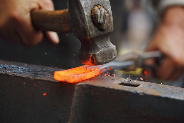 Forging hot iron
