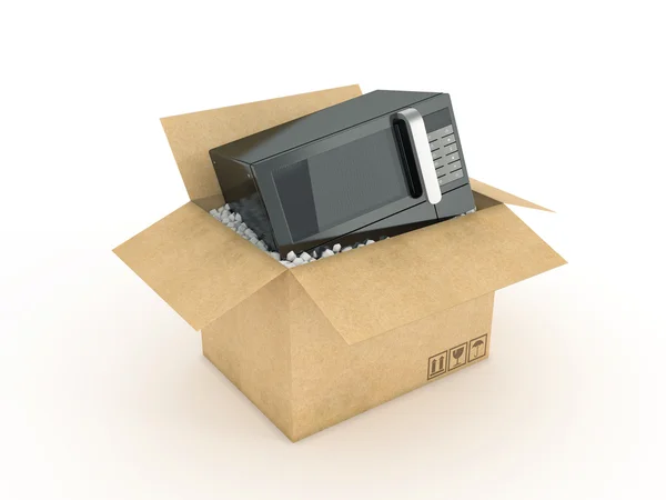 Micro-ondes dans une boîte en carton — Photo