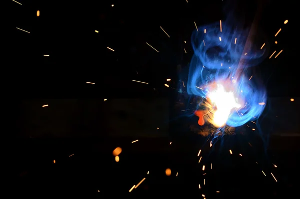 Drop of molten iron and sparks — Stock Photo, Image