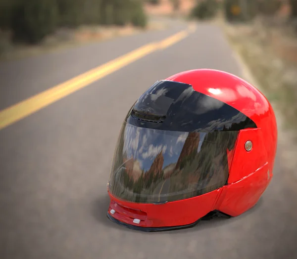 Red motorcycle helmet on the ground on the road — Stock Photo, Image