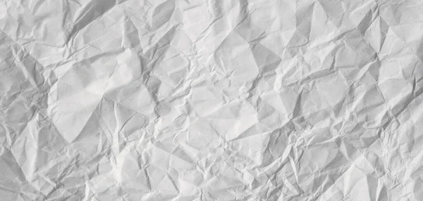 Gray blank creased paper texture. Crumpled paper sheet background. — Stok fotoğraf