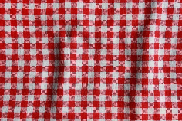 Textura de um cobertor de piquenique quadriculado vermelho e branco . — Fotografia de Stock