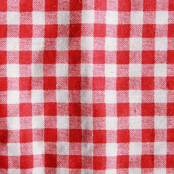 Texture di una coperta da picnic a quadretti rossi e bianchi . — Foto Stock