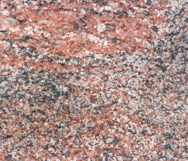 Old red granite background with scratches. — Stock Photo, Image