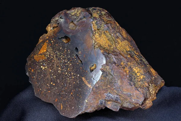 Brown iron ore close up, sample of hematite with limonite (iron ore). Deposit Russia