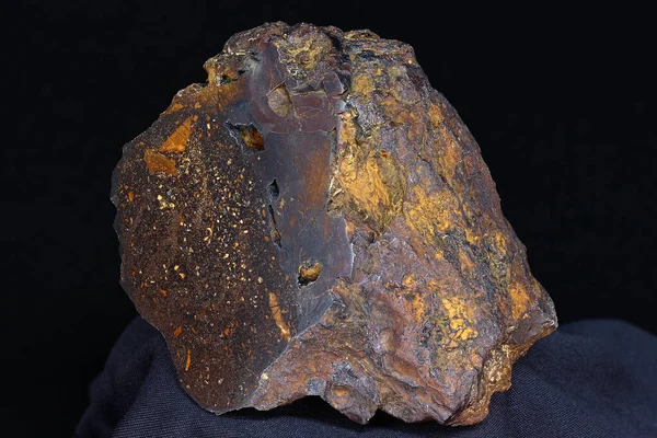 Brown iron ore close up, sample of iron ore (hematite with limonite). Deposit Russia