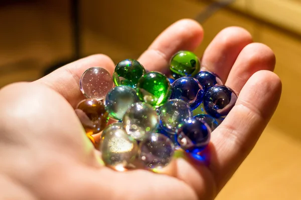 Multicolored Glass Balls Palm Closeup — Stockfoto