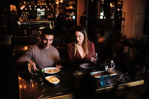 Young couple on a date at the restaurant.