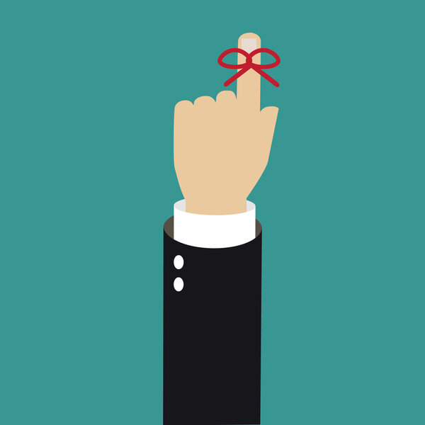 рука с красной лентой на пальце
