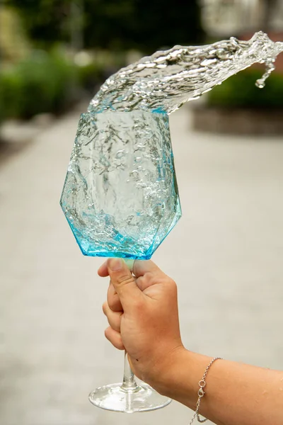 Blue Water Spilling in a Wine Glass