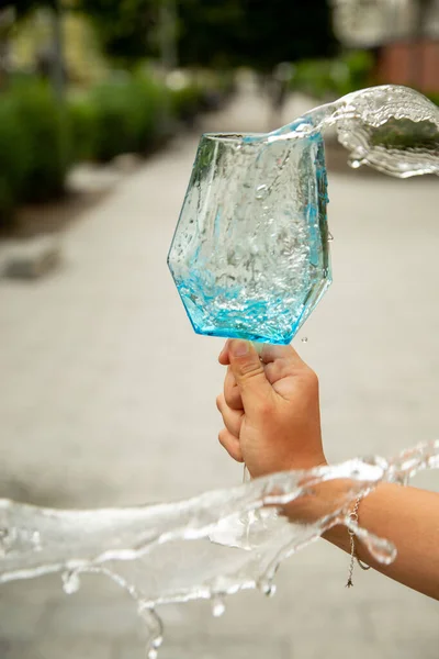 Blue Water Spilling Wine Glass — Stock Photo, Image