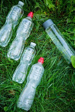 glass bottle instead of plastic water bottle, environmental protection, water splash, green grass