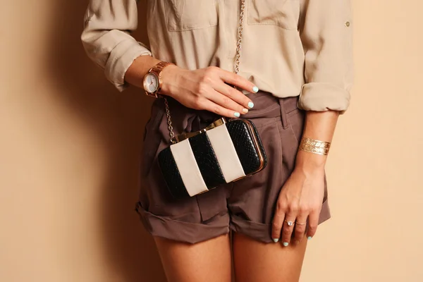 Fashionable woman with  stylish black and white clutch — Stock Photo, Image