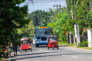 BENTOTA, SRI LANKA - DECEMBER 31, 2015: Regular public bus. Buses are the most widespread public transport type in Sri Lanka. clipart