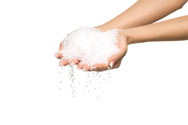 Sea salt crystals in women hand — Stock Photo, Image