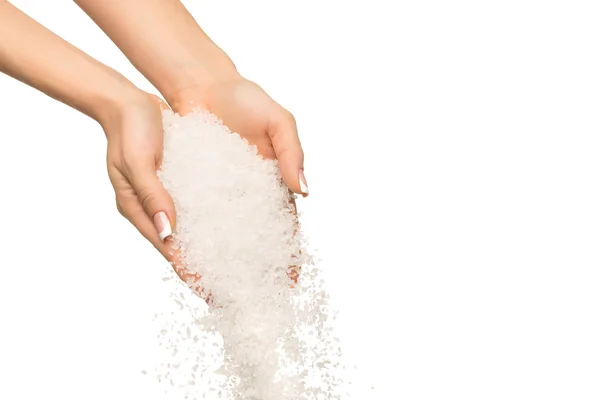 Sea salt crystals in women hand — Stock Photo, Image