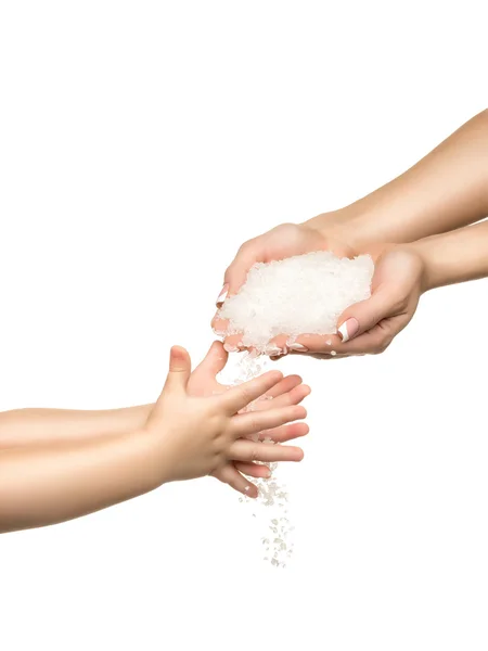 Sea salt crystals in women hand and child hand. — Stock Photo, Image