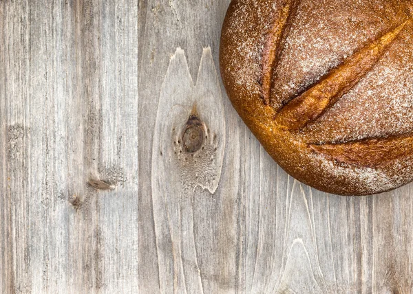 Bread on a wooden background — Stock Photo, Image