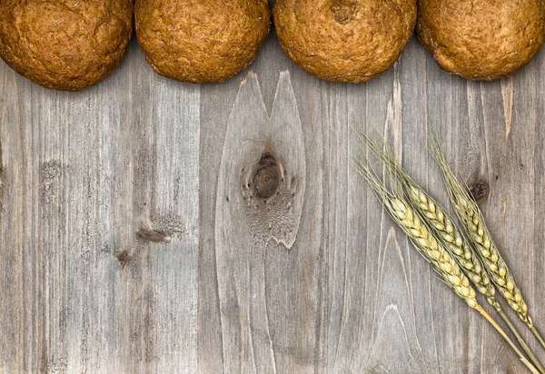 Bread on a wooden background — Stock Photo, Image