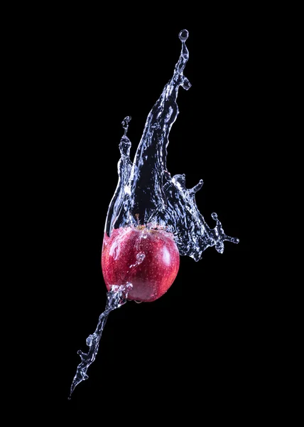 Red apple splashing into water — Stock Photo, Image