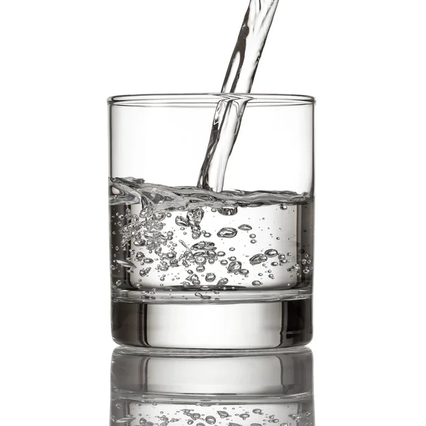 Cold water pour water to glass on white — Stock Photo, Image