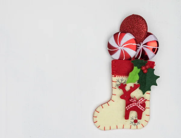 Christmas decorations and sock on white — Stock Photo, Image