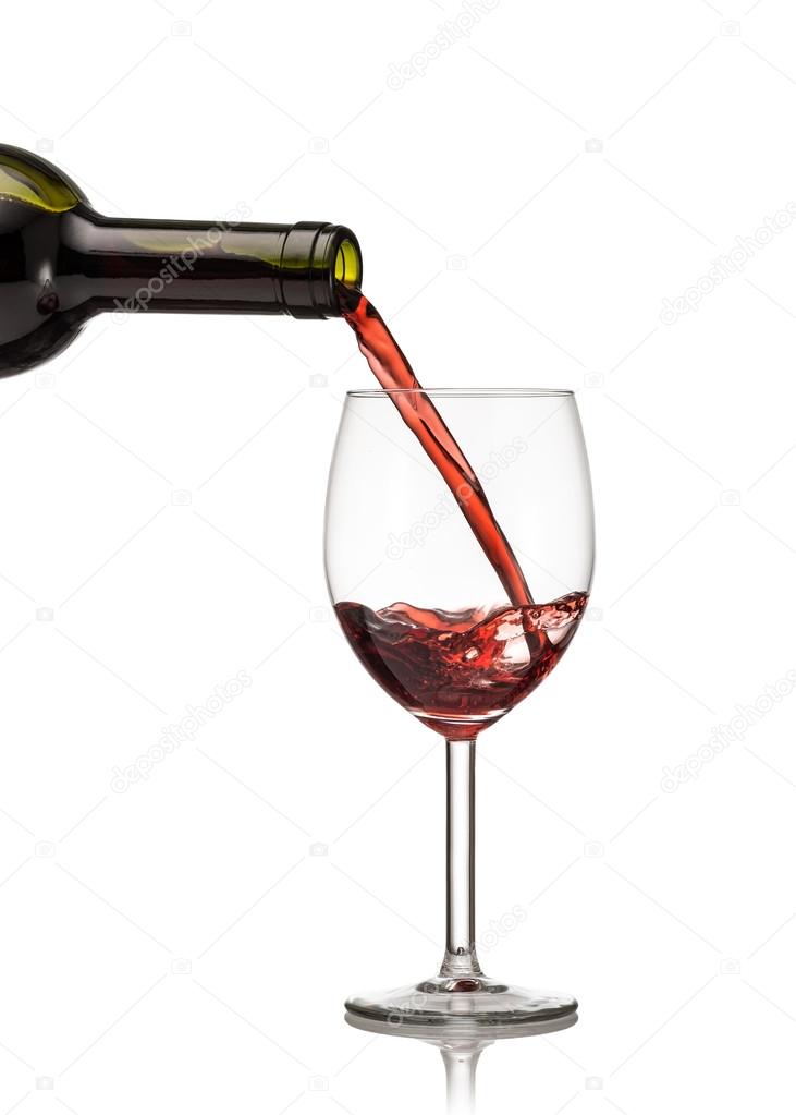 Red wine being poured into wine glass 