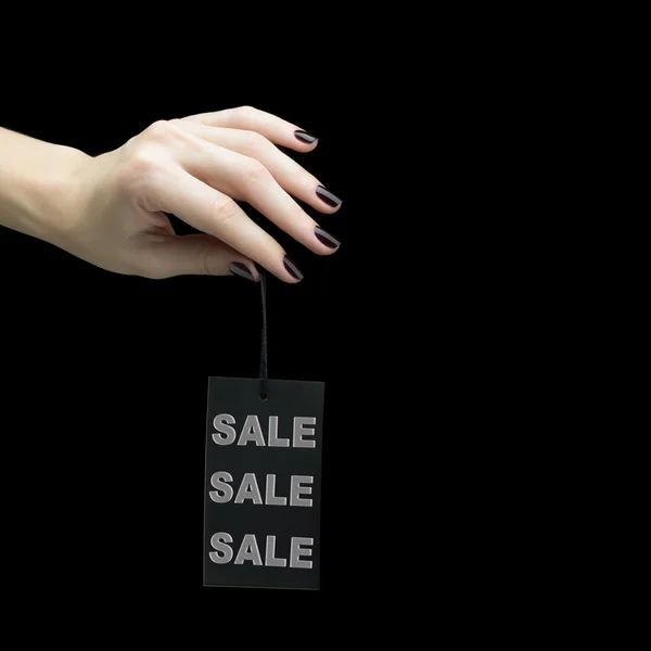 Tag da venda na mão das mulheres — Fotografia de Stock
