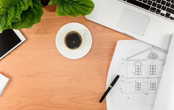 Office desk, Working on a Wooden Table with notebook and House p — стоковое фото