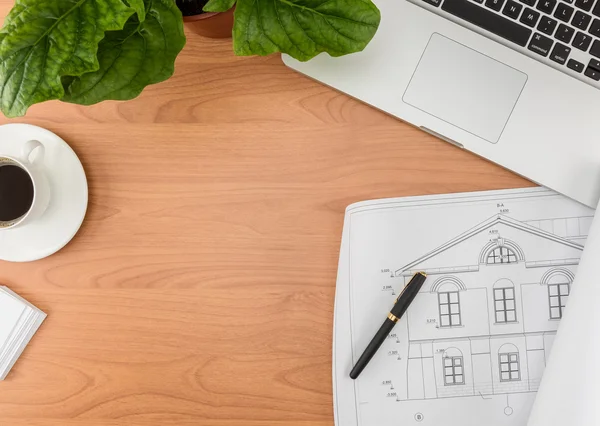 Office desk, Working on a Wooden Table with notebook and House p — стоковое фото