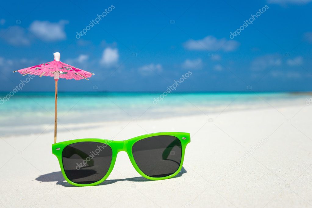 Picture of sunglasses on the tropical beach, vacation. Traveler 